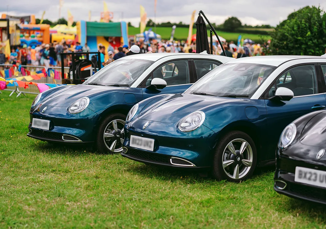 ORA 03 Cars in a festival field